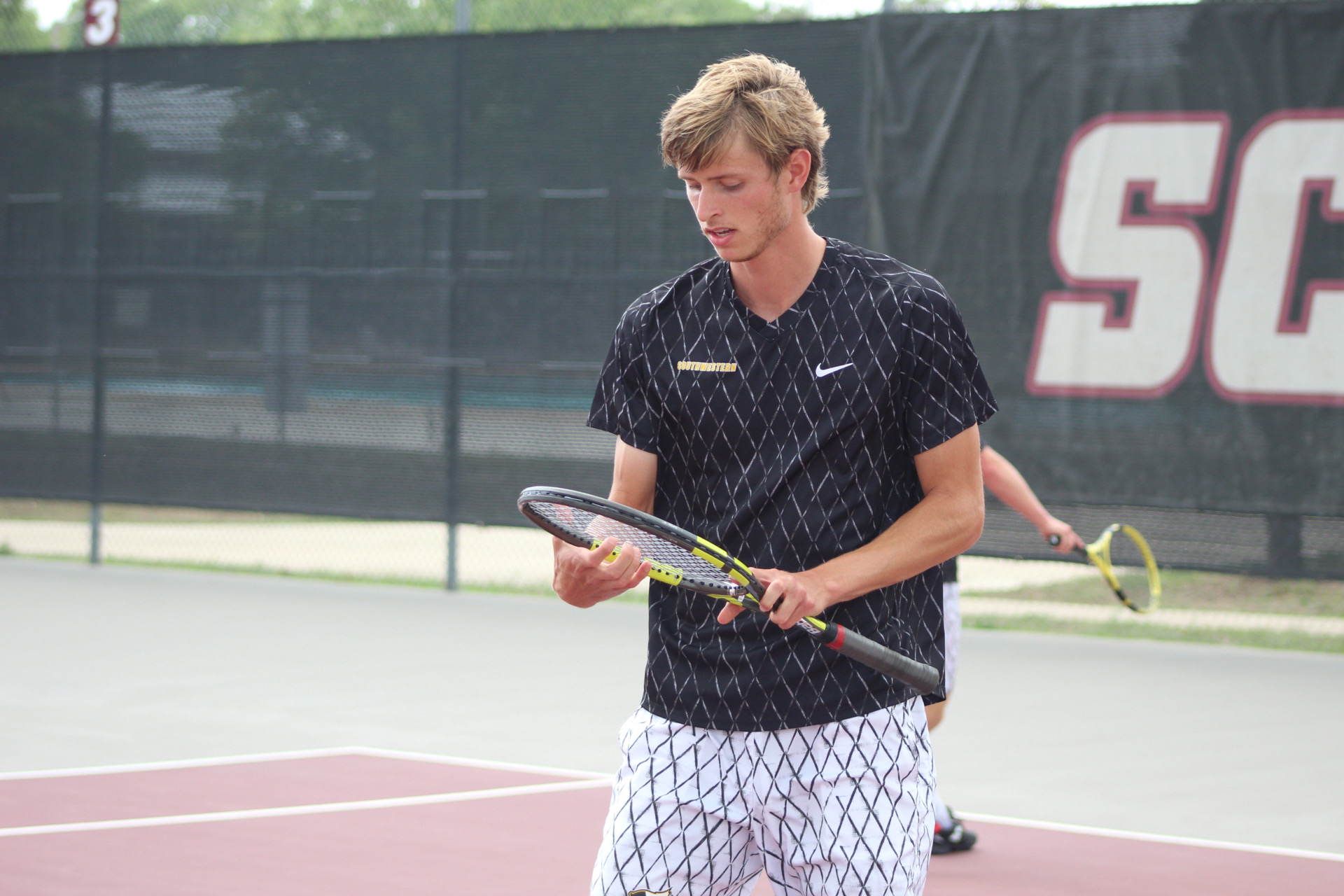 Men's Tennis Defeated by Trinity in Championship Match