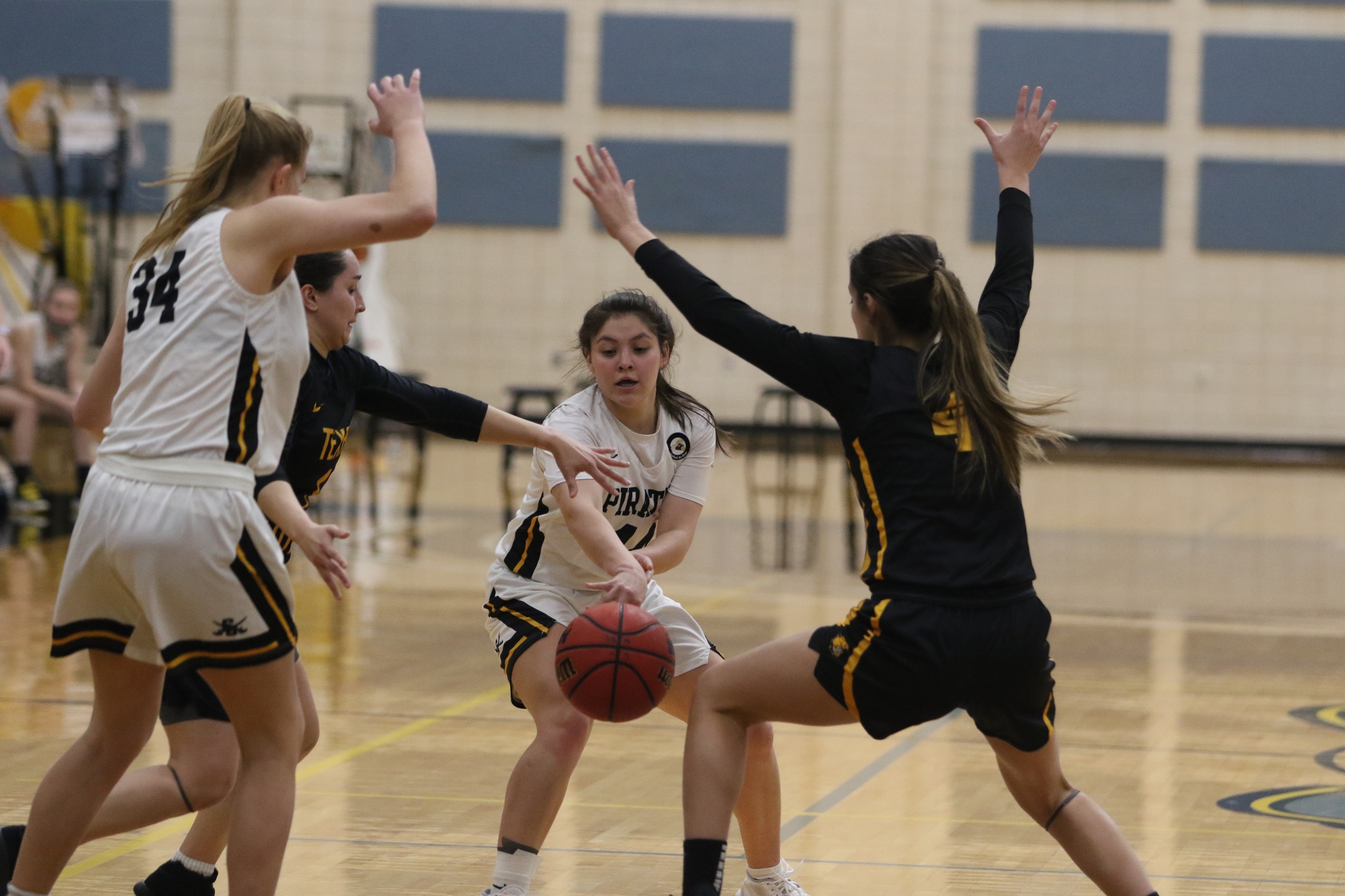 Emily Edwards tries to thread a pass through a thicket of Texas Lutheran defenders. 