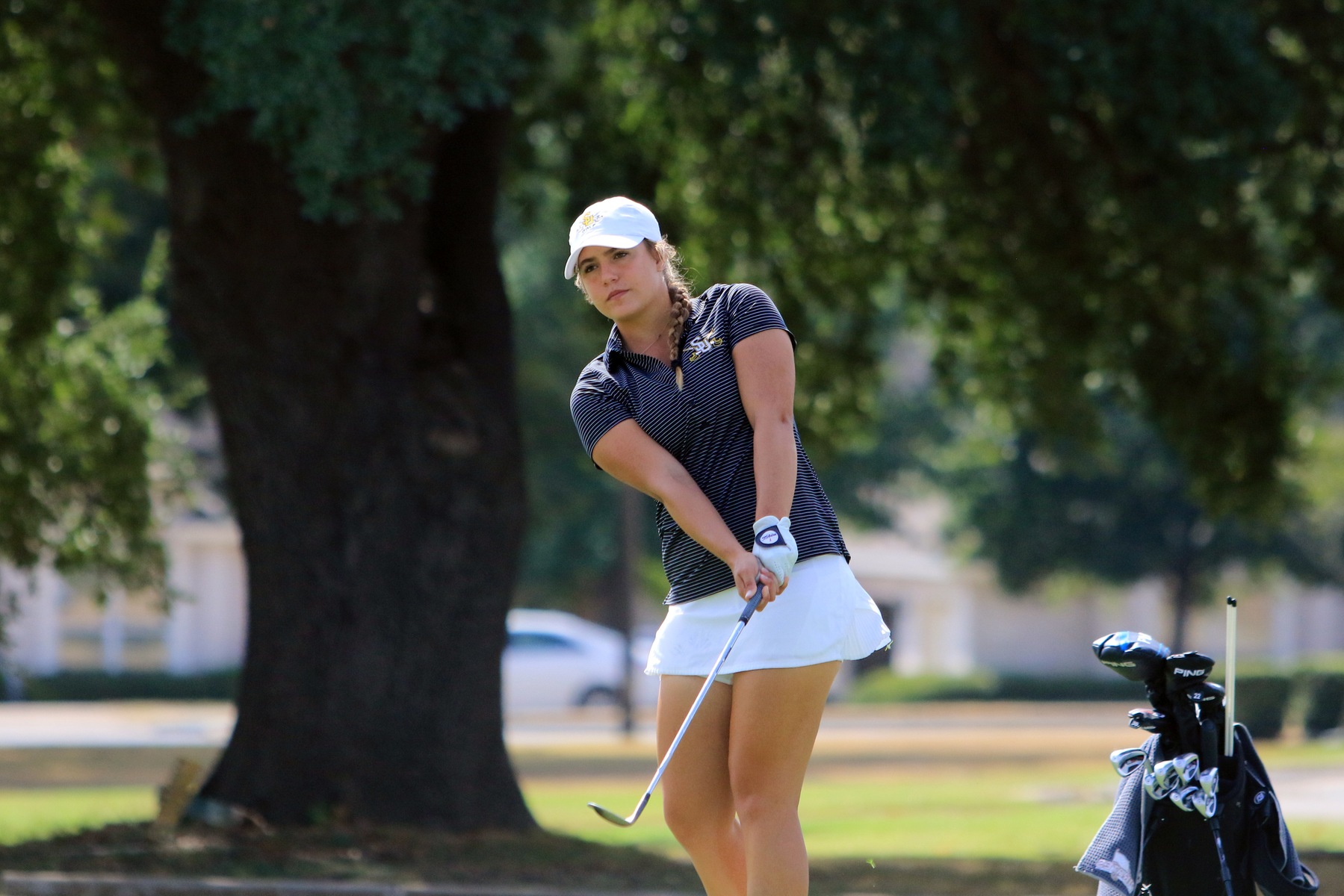 Sophomore women's golfer Madison Goldberg hits a chip shot. 