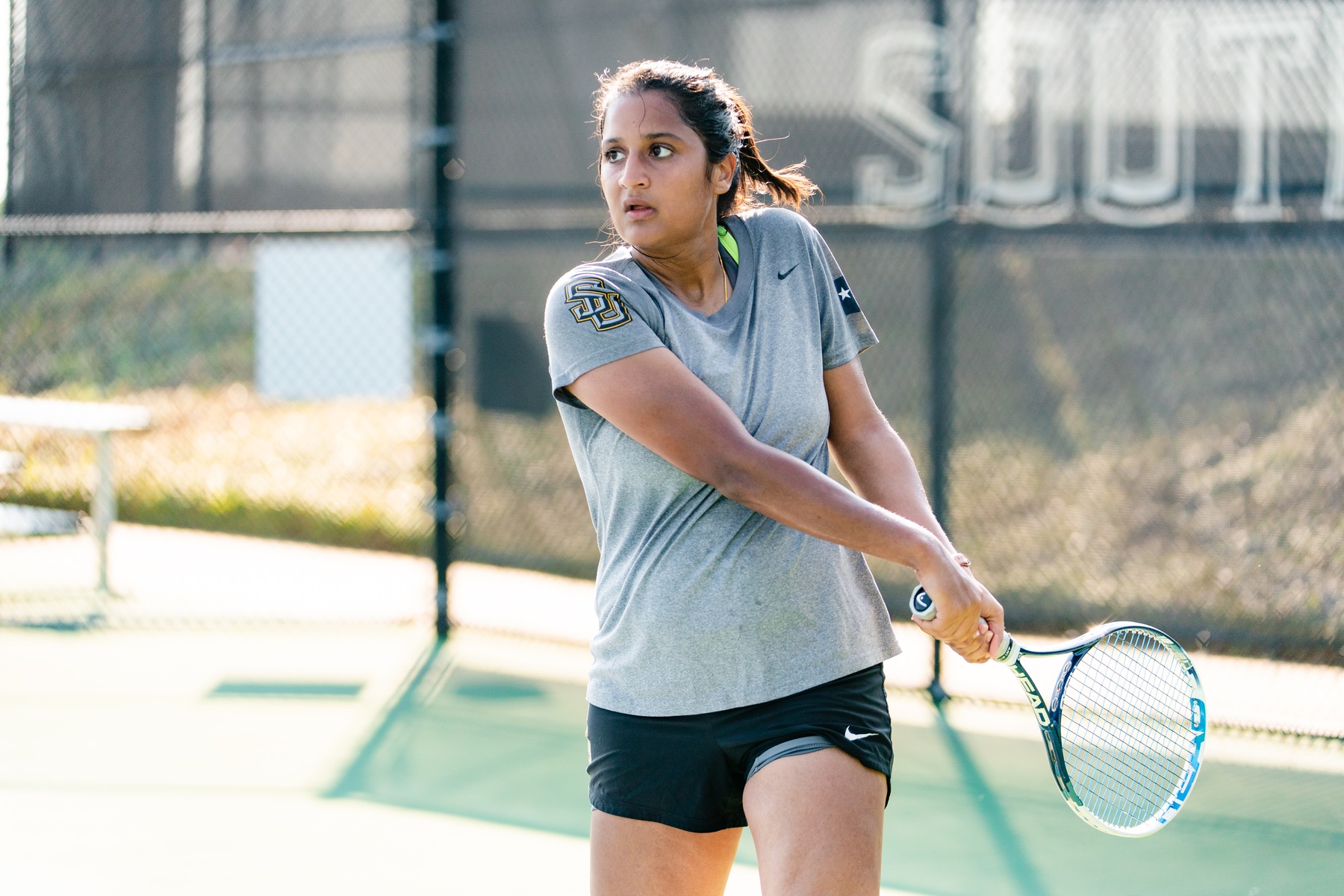 Southwestern University Pirates women's tennis player Meeshti Shethia returns a serve. 